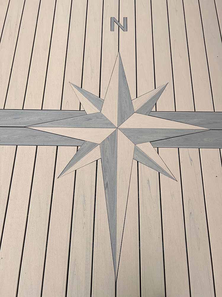 Nautical compass emblem built into deck