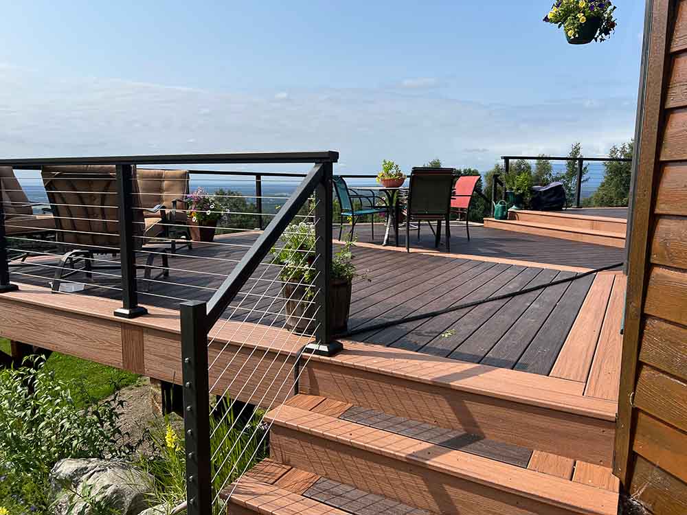 Deck with cable railing matching stairs