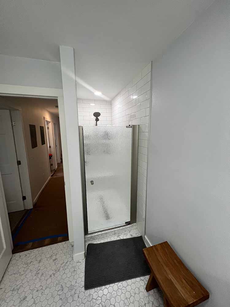 White walls bathroom shower door construction